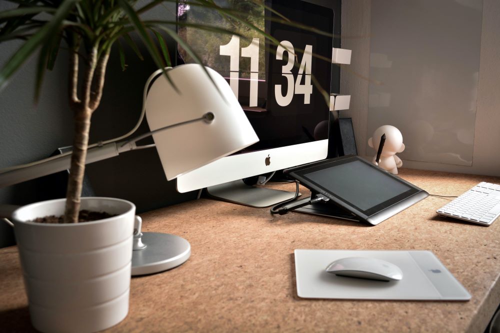 Neat and tidy desk with a white lamp and mouse